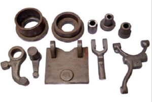 Industrial forged and cast components including levers, bushings, and brackets for heavy machinery applications