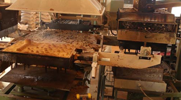 Shell moulding setup with heated pattern for forming resin-coated sand shell