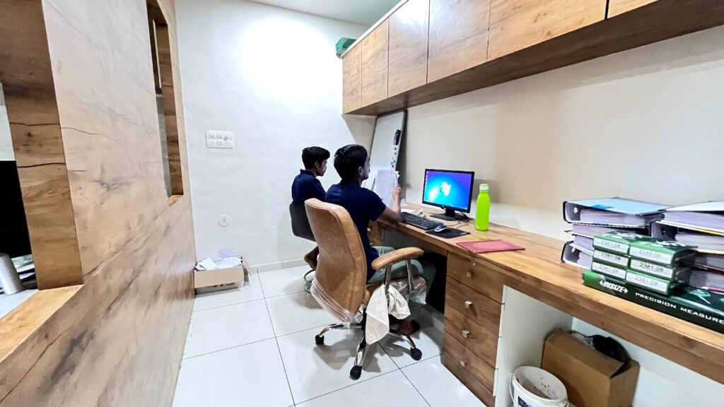Engineer analyzing technical drawing of machined component in office
