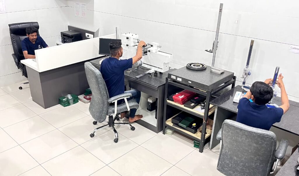 "Final quality inspection of precision-machined component at Karmayogi Engineers